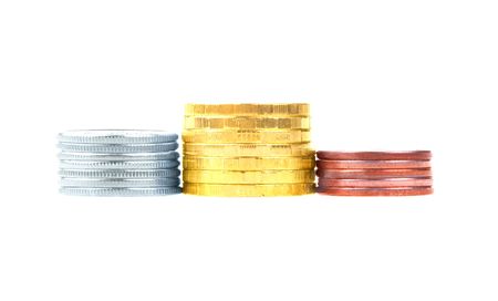Gold, silver and bronze stacks of coins isolated on white backgroundの写真素材