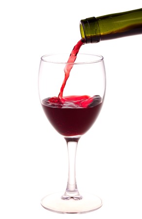 Red wine pouring from a wine bottle isolated on white backgroundの写真素材