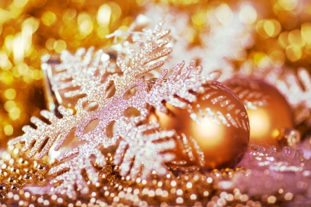 Greeting card with Christmas ball and snowflake in gold designの写真素材