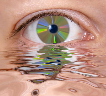 Eye with cd is reflecting in the waterの写真素材