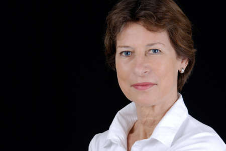 Portrait from a senior business woman. Picture was taken in a studio.の写真素材