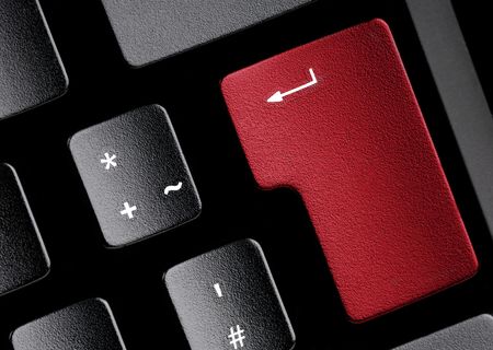 Black keyboard with a red key. Use it for technical concepts.の写真素材