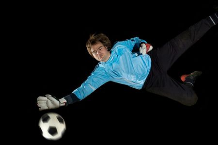 Goalkeeper defends ballの写真素材