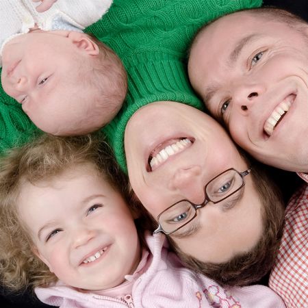 Mother, father and two daughters. Studio pictureの写真素材