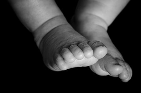 Foot from a four weeks old . Studio picture in black and white