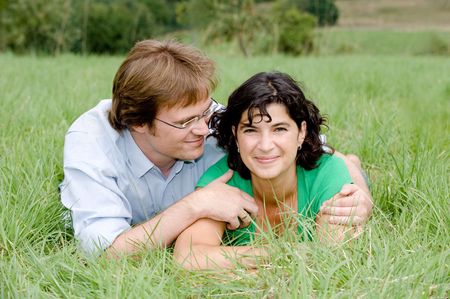 Young couple on a farmers meadow. の写真素材