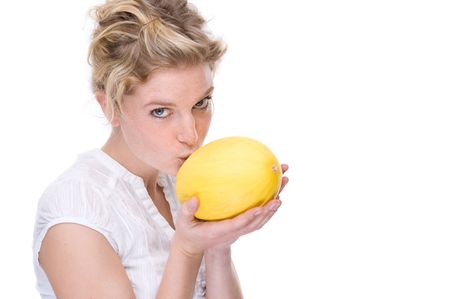 Full isolated portrait of a beautiful  caucasian woman with a melonの写真素材