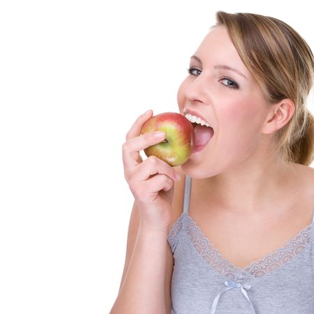 Full isolated portrait of a beautiful caucasian woman with appleの写真素材