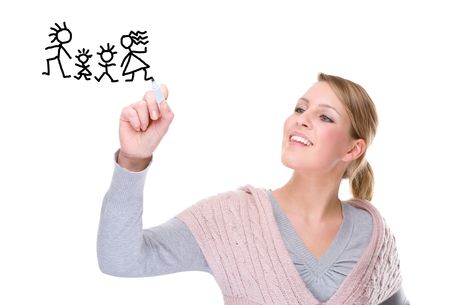 Full isolated portrait of a beautiful caucasian woman drawing a family pictureの写真素材