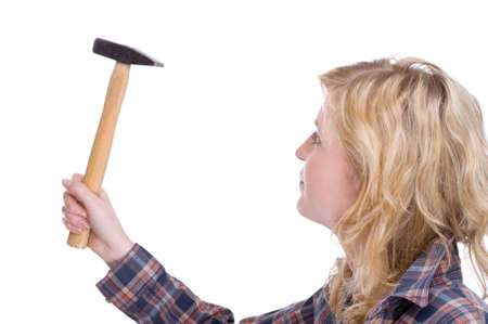 Full isolated portrait of a beautiful caucasian craftswoman with a hammerの写真素材