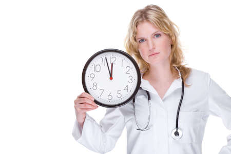 Full isolated portrait of a beautiful caucasian doctor with a clockの写真素材