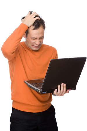 Full isolated studio picture from a man despairing with his computerの写真素材