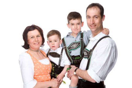 Full isolated studio picture from parents holding their two sonsの写真素材