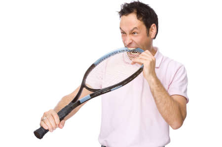 Full isolated studio picture from a young man with tennis racketの写真素材