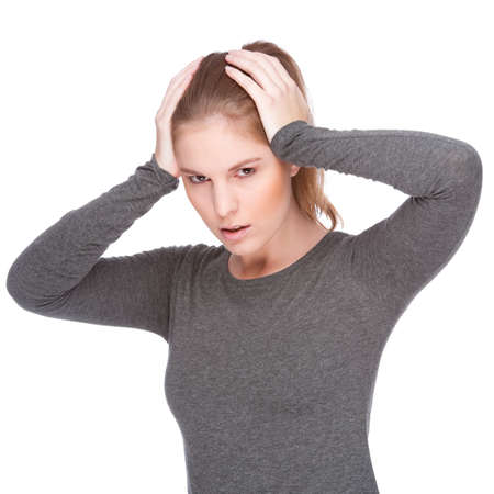 Full isolated portrait of a caucasian woman with headache