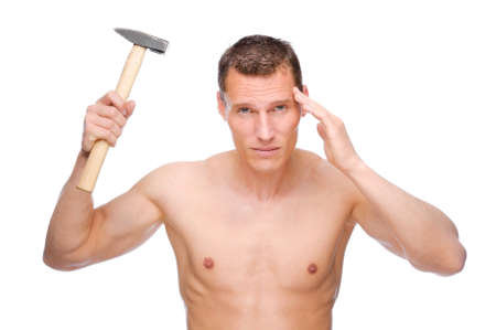 Full isolated studio picture from a young naked man with headacheの写真素材