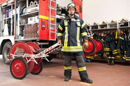 Picture from a young and successful firefighter at workの写真素材