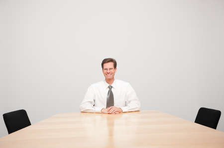 Middle aged and successful businessman in his office