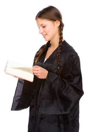 Full isolated studio picture from a young judge (lawyer) with statute bookの写真素材