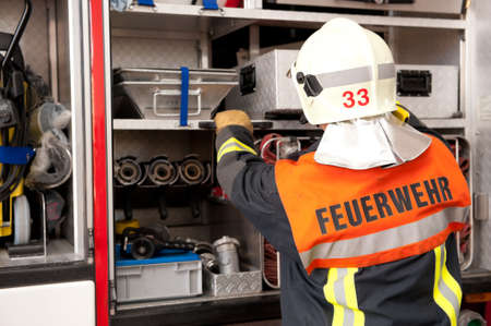 Picture from a young and successful firefighter at workの写真素材