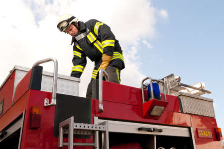 Picture from a young and successful firefighter at workの写真素材