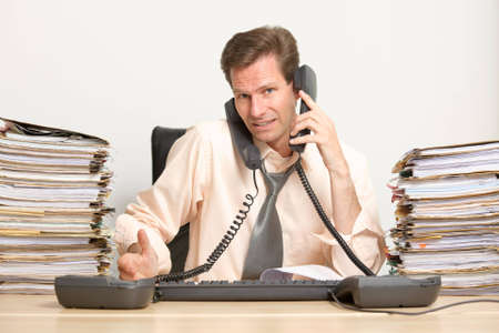 Middle aged businessman in his officeの写真素材