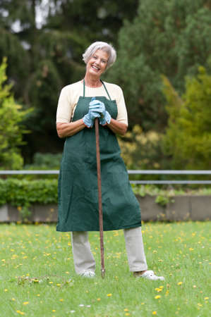 Active senior woman in the gardenの写真素材