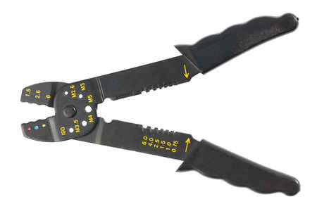 Black crimping tool in front of white backgroundの写真素材