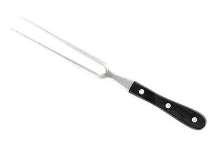 Meat fork in front of white backgroundの写真素材