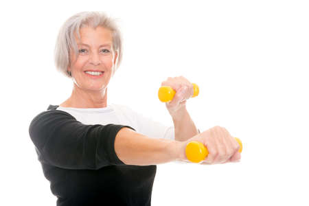 Active senior woman at workout in front of white backgroundの写真素材