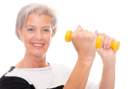 Active senior woman at workout in front of white backgroundの写真素材