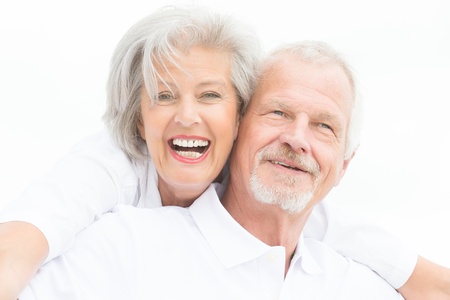Happy and smiling couple in front of white skyの写真素材