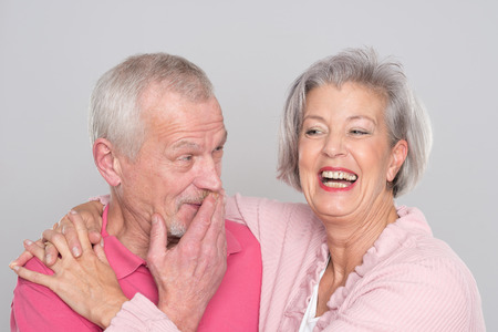Senior couple  in front of grey backgroundの写真素材