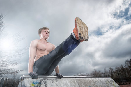 Streetworkout in front of grey sky