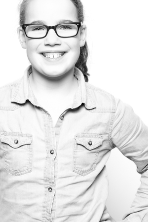 Portrait from a young girl in front of white backgroundの写真素材