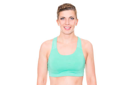 Young and sporty woman in front of white backgroundの写真素材