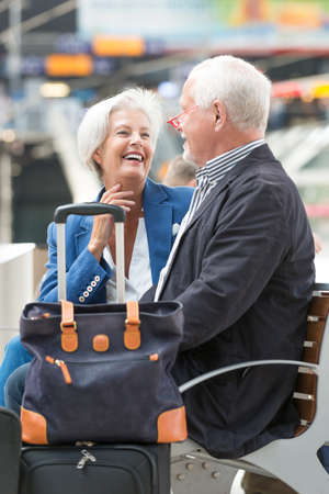 Senior couple at the railway stationの写真素材