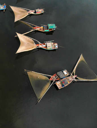 Fishing boat with fishing net in Nghe An province northern Vietnamの写真素材