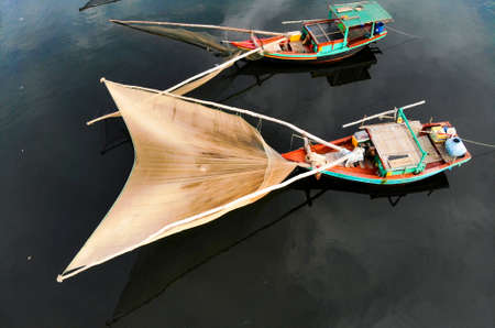 Fishing boat with fishing net in Nghe An province northern Vietnamの写真素材