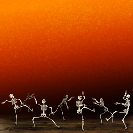 Halloween skeletons. Orange background.の写真素材