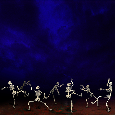 Halloween skeletons. Dark blue background.の写真素材