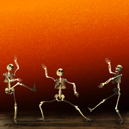Halloween skeletons dancing. Orange background.の写真素材