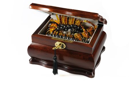 Jeweller casket with amber necklace, black pearl necklace isolated on whiteの写真素材