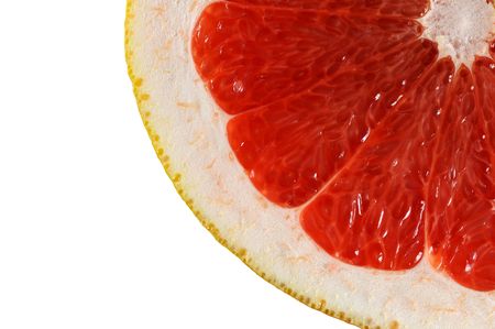 Macro view slice of grapefruit isolated on whiteの写真素材