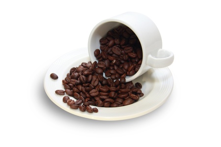 White cup with coffee beans isolated の写真素材