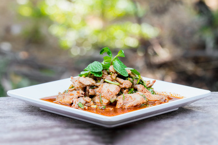 Hot and Spicy Grilled Pork Salad, Nam Tok Moo, Thailand foodの写真素材