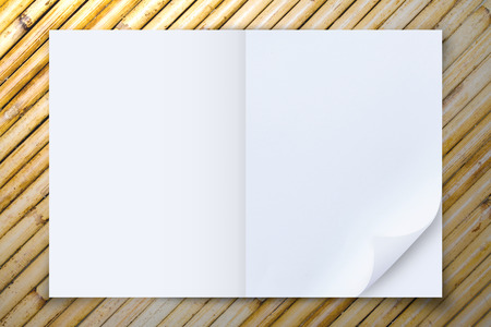 Open blank paper on wooden background, Top viewの写真素材