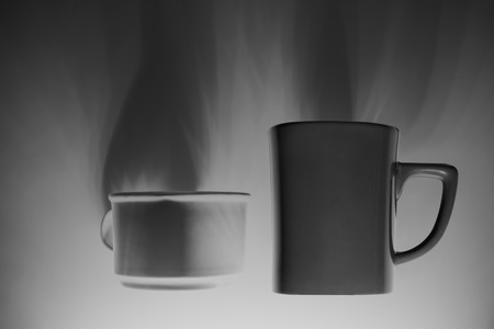 coffee cup white and gray have a shadow on white background. black and white colorの写真素材
