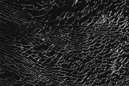 Abstract background of cracked and broken glass. black and white color backgroundの写真素材