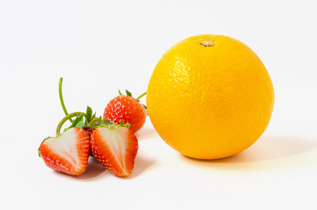 close up Strawberries and orange fruit isolated on white backgroundの写真素材